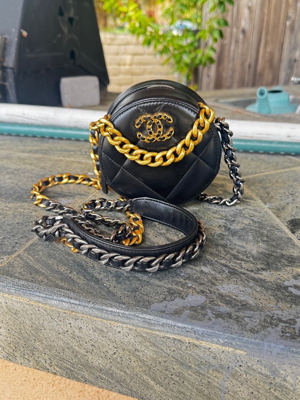 CHANEL Black Quilted Round Crossbody with Gold and Silver Chain